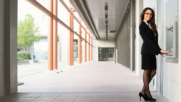 Professional woman using the ATM Professional woman using the ATM